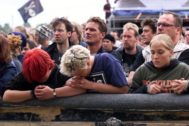 MUSIC FANS PRAY FOR VICTIMS AT ROSKILDE