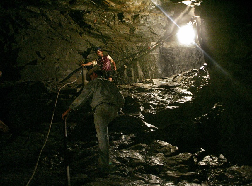 Brazilian mine workers work in Ouro Verde gold mine in Amazon jungle