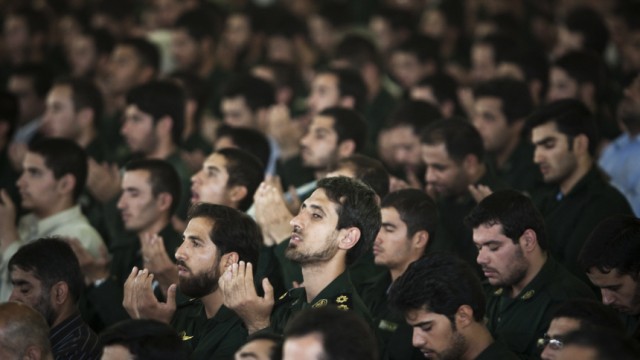 Members of Iran's Revolutionary Guard attend Friday prayers at Zahedan Grand Mosque in Tehran