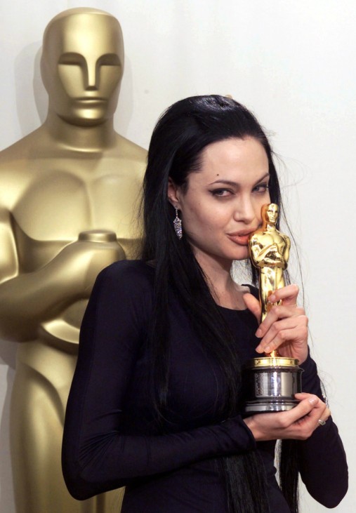 ACTRESS ANGELINA JOLIE POSES WITH BEST SUPPORTING OSCAR AWARD