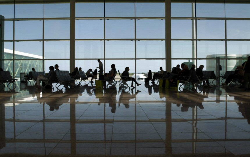Passengers wait for their flights at the new T-1 terminal at Barcelona's El Prat airport