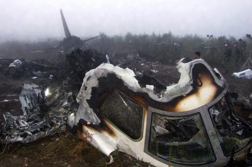 The wreckage of a crashed passenger plane is seen in Yichun
