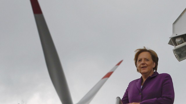 German Chancellor Merkel poses as she visits a wind turbine park 'WIND-projekt' in Ravensberg