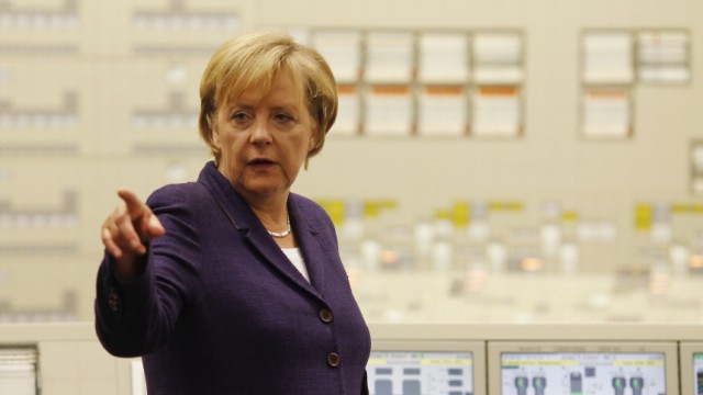 German Chancellor Merkel points during visit in control centre at nuclear power plant in Lingen