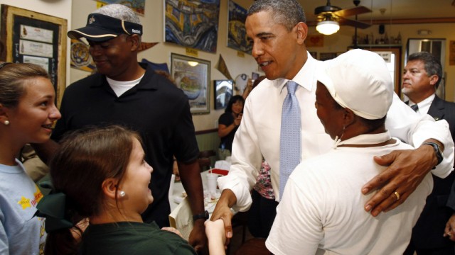U.S. President Barack Obama greets patrons and staff at Parkway Bakery and Tavern in New Orleans, Louisiana