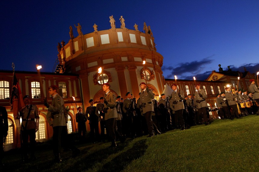 German soldiers march during a military tattoo to honour Roland Koch, the outgoing Premier of Germany's federal state of Hesse at the Biebrich castle in Wiesbaden