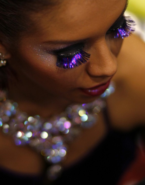 Tango dancer Vargas of Colombia wearing fake eyelashes waits backstage before competing in the Tango Dance World Championship in Buenos Aires