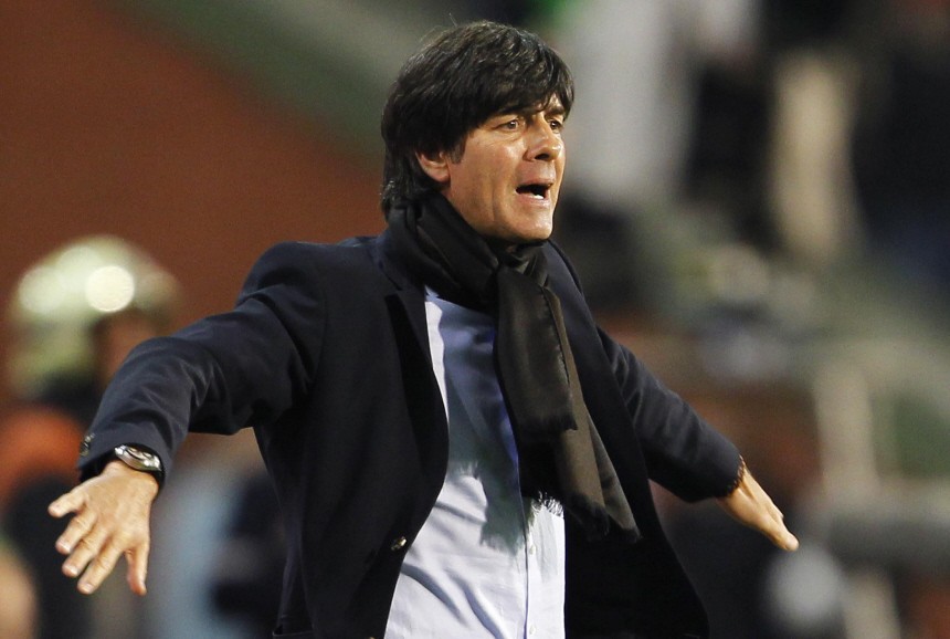 Germany's national soccer team coach Loew gives instructions during their Euro 2012 qualifying soccer match against Belgium in Brussels