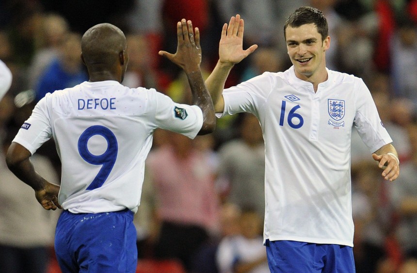 England's Johnson celebrates with Defoe after scoring during Euro 2012 qualifying soccer match against Bulgaria at Wembley Stadium