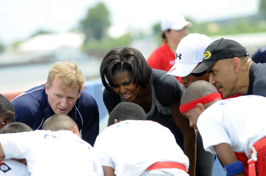 Goodell, Obama and Tongy huddle during flag football with children to promote the first lady's 'Let's Move' campaign to fight childhood obesity in New Orleans