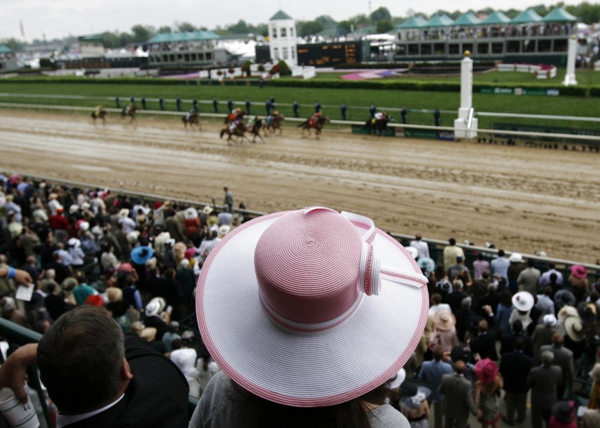 A race fan watches a race ahead of the 135th running of the Kentucky Derby at Churchill Downs in Louisville